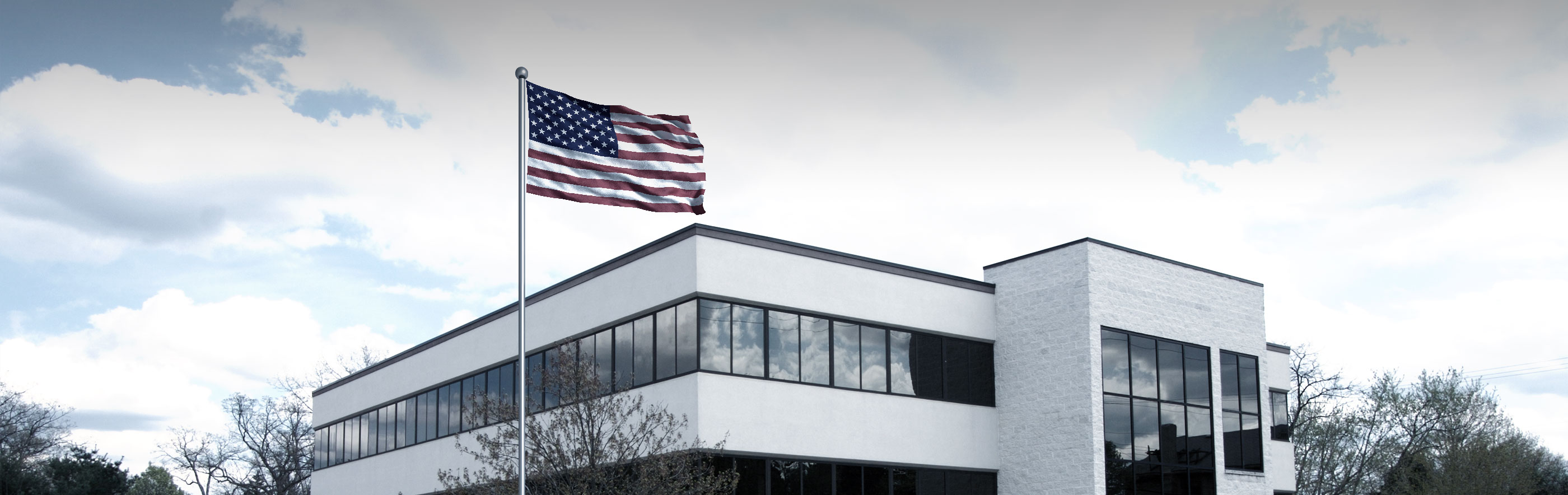 ProCon Roofing Corporation office with American flag flying outside office building